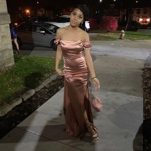 A satin pink shoulder homecoming dress
